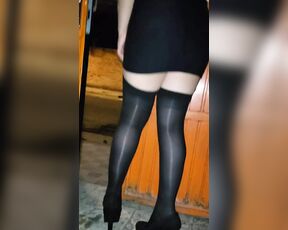 Exhibit in high heels and stockings