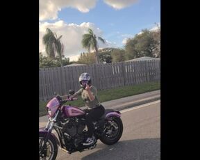 Bonnie public flashing while riding motorcycle