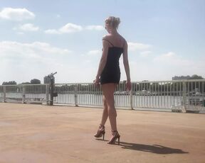 Black high heel sandals by the river